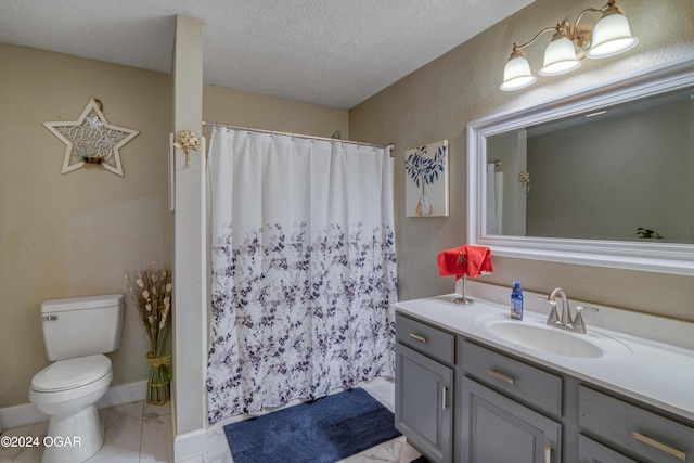 bathroom with vanity, a shower with curtain, a textured ceiling, and toilet