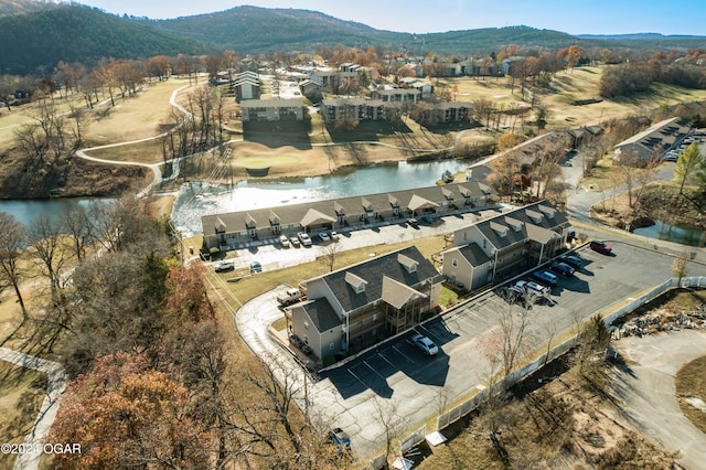 birds eye view of property featuring a water and mountain view