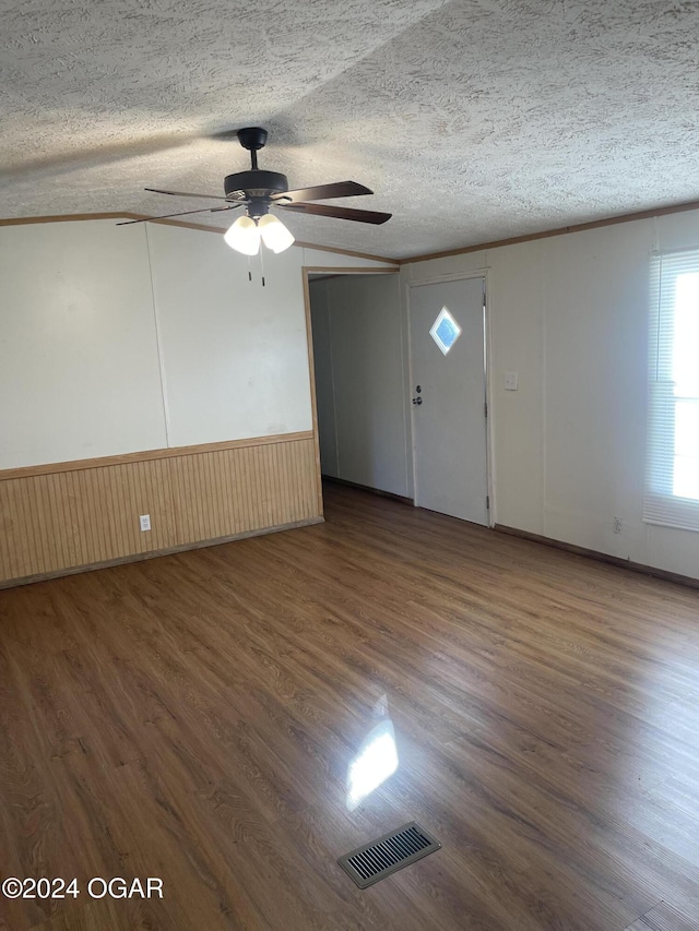 interior space featuring a textured ceiling, dark hardwood / wood-style floors, and ceiling fan