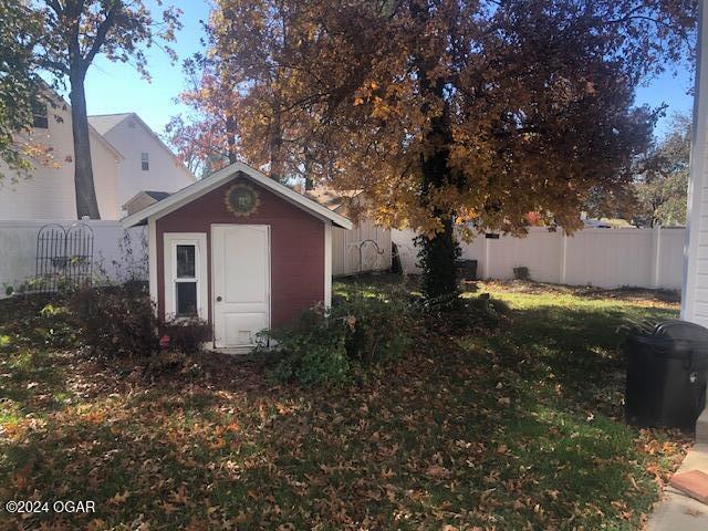 view of shed with a fenced backyard