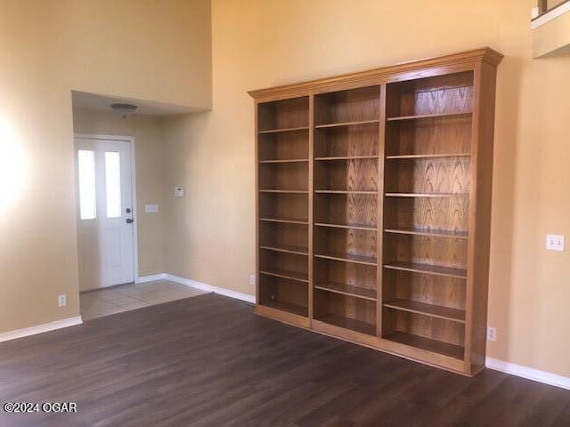 interior space with baseboards and wood finished floors