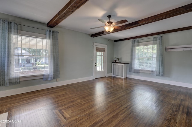 unfurnished living room with beam ceiling, ceiling fan, and dark wood-type flooring