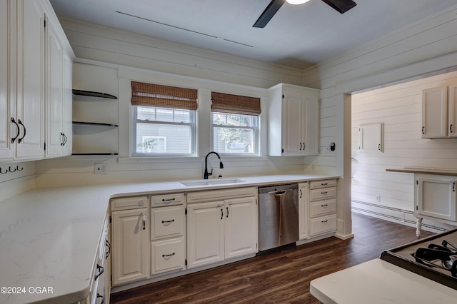 kitchen featuring white cabinets, sink, dishwasher, dark hardwood / wood-style floors, and wood walls