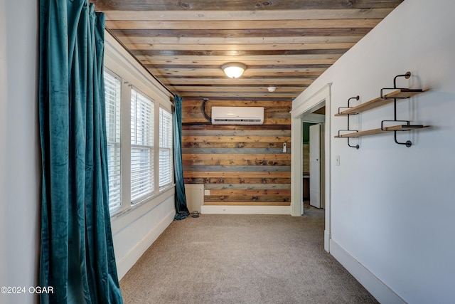 carpeted spare room featuring wooden ceiling, a wall unit AC, and wooden walls