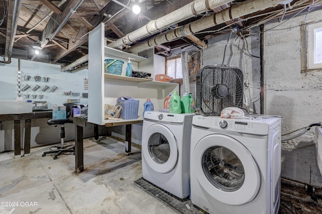 washroom with a workshop area, plenty of natural light, and washing machine and clothes dryer