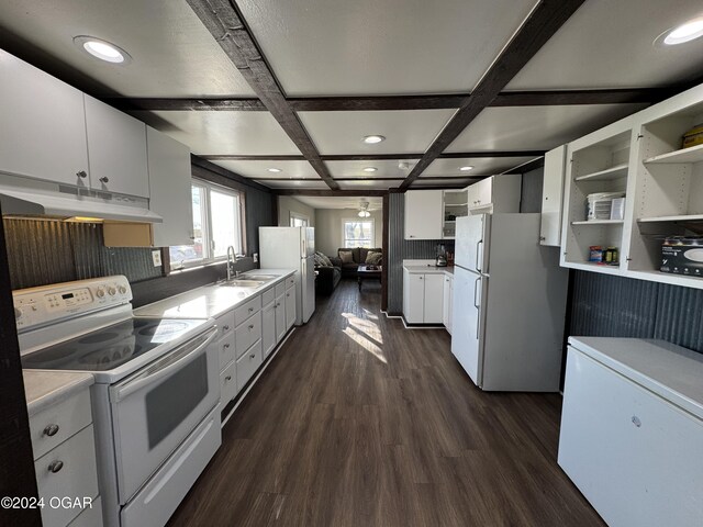 kitchen with coffered ceiling, white cabinets, and white appliances