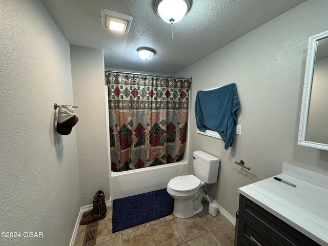 full bathroom featuring tile patterned floors, a textured ceiling, vanity, shower / bathtub combination with curtain, and toilet