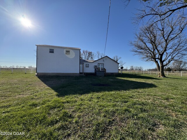 exterior space with a rural view