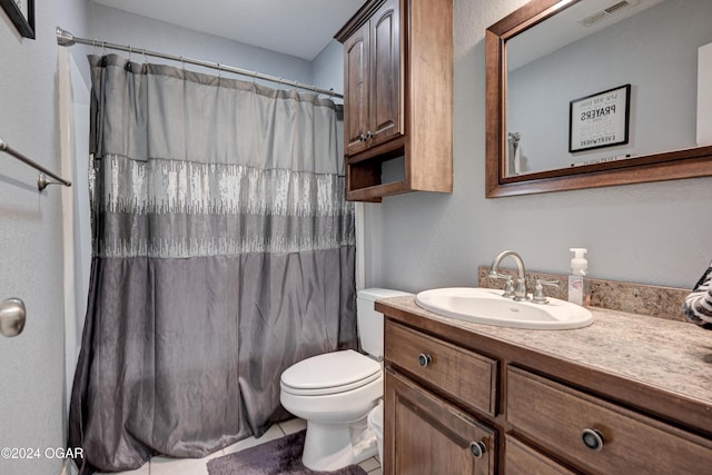 bathroom featuring tile patterned flooring, vanity, toilet, and a shower with shower curtain