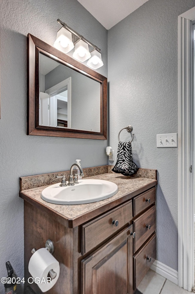 bathroom featuring tile patterned floors and vanity