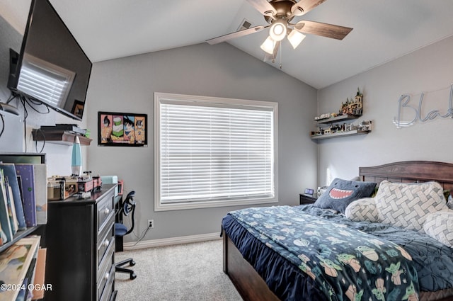 carpeted bedroom with ceiling fan and lofted ceiling