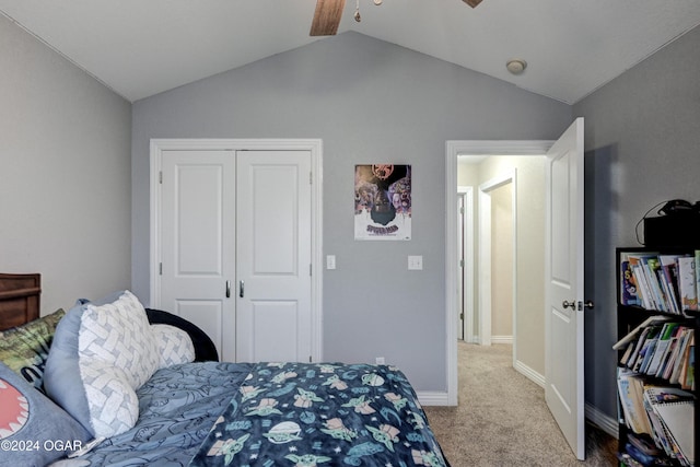 carpeted bedroom featuring vaulted ceiling, a closet, and ceiling fan