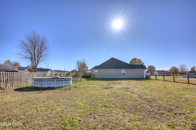 view of yard featuring a covered pool