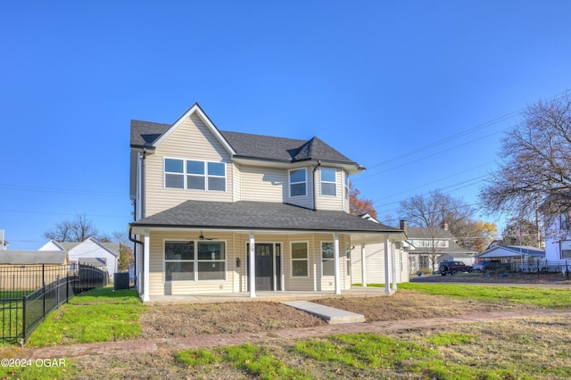 view of front of property featuring a porch and a front yard