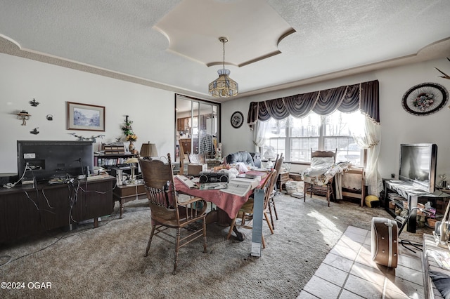 dining space with carpet floors and a textured ceiling