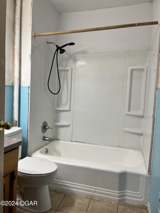 full bathroom featuring tile patterned flooring, bathtub / shower combination, vanity, and toilet