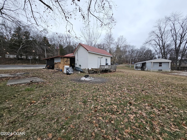 view of side of property featuring a deck