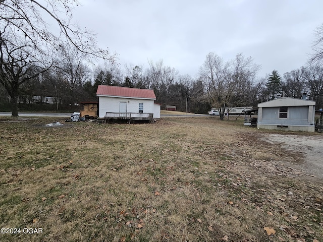 view of yard with a wooden deck