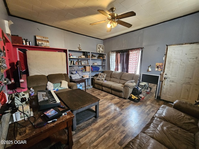 living room featuring ceiling fan and hardwood / wood-style floors