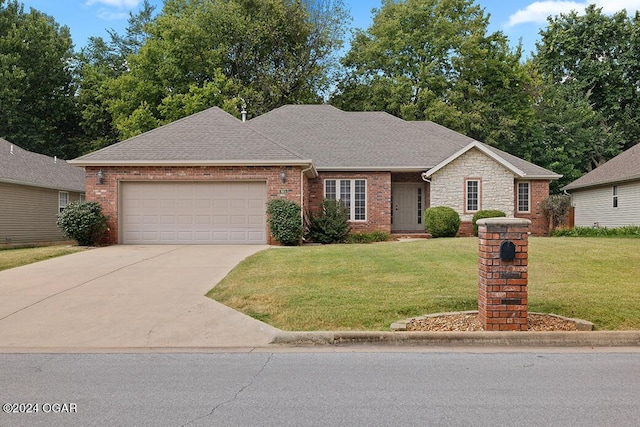 ranch-style home with a front lawn and a garage