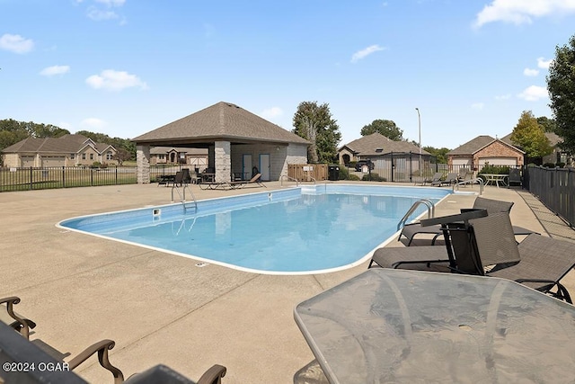 view of swimming pool with a patio