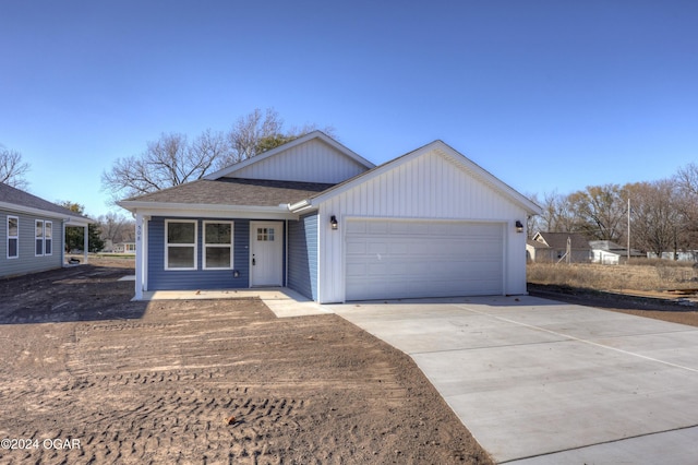 single story home with a garage