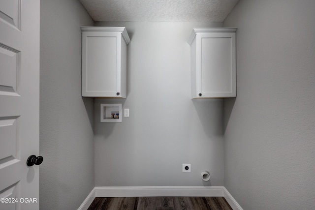 laundry area with a textured ceiling, hookup for a washing machine, dark hardwood / wood-style floors, and hookup for an electric dryer