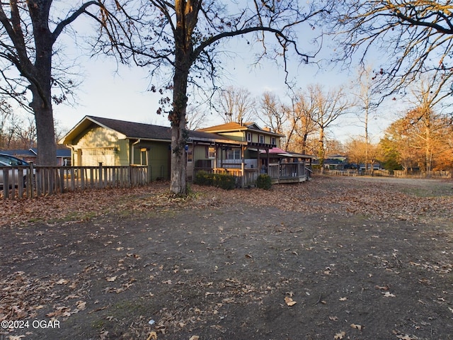 view of front of property with a wooden deck