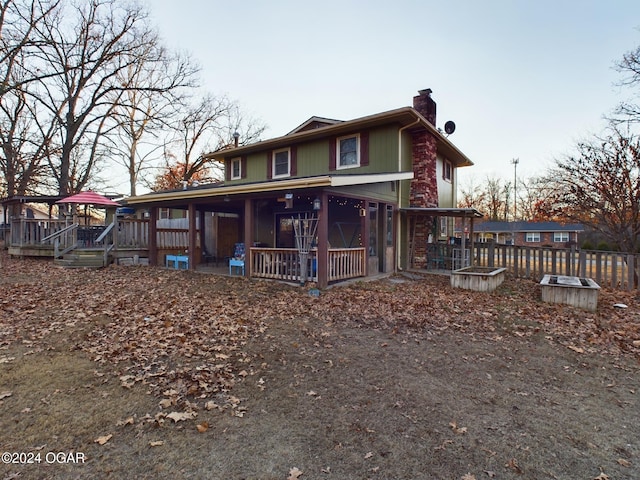 rear view of house with a porch