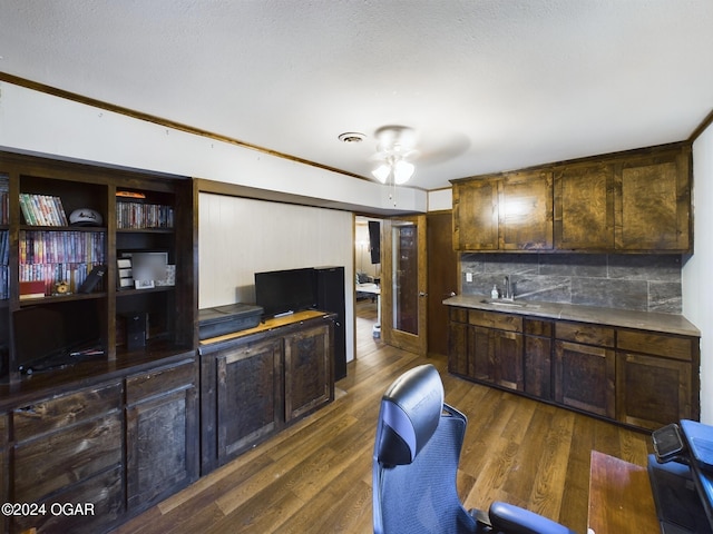 kitchen with dark hardwood / wood-style floors, ceiling fan, dark brown cabinetry, and decorative backsplash