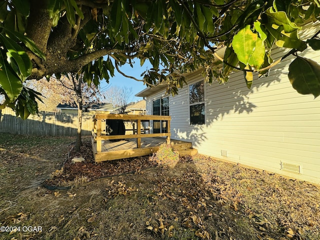 view of yard with a wooden deck