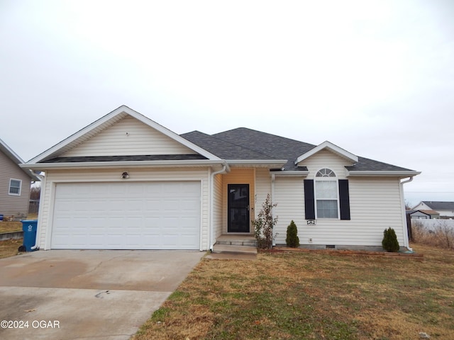 single story home featuring a garage and a front yard