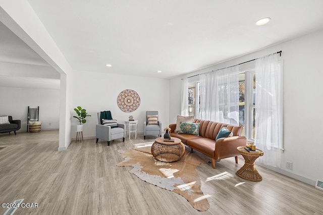 living room with light hardwood / wood-style floors