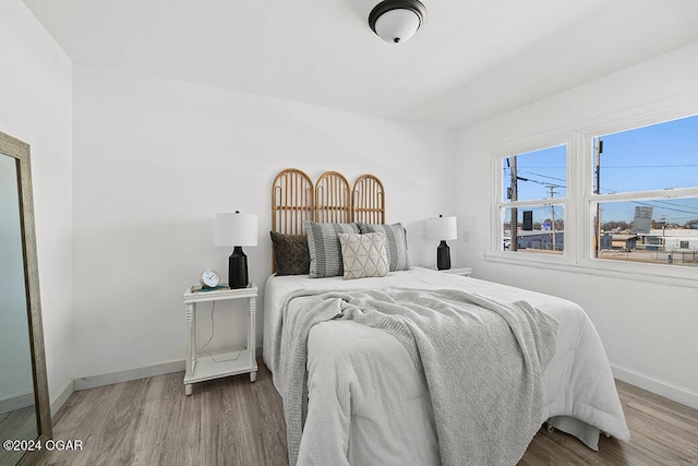 bedroom with light hardwood / wood-style flooring