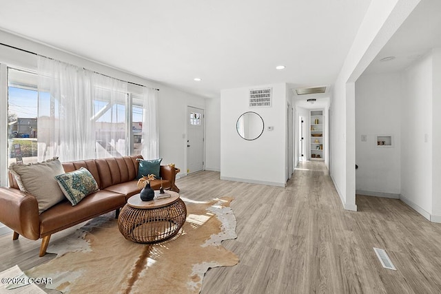 living room with light hardwood / wood-style floors