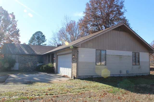 view of side of property featuring a garage