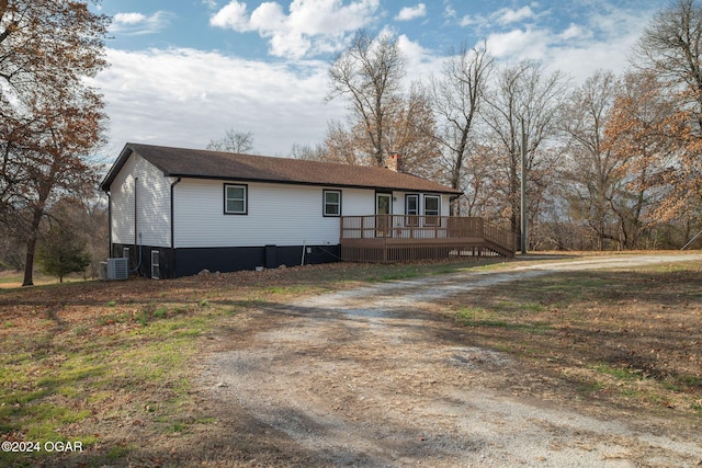 view of front of property featuring cooling unit and a wooden deck