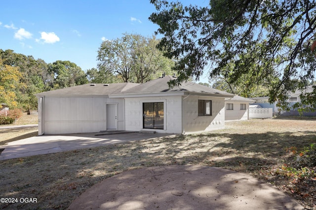 rear view of property featuring a patio area