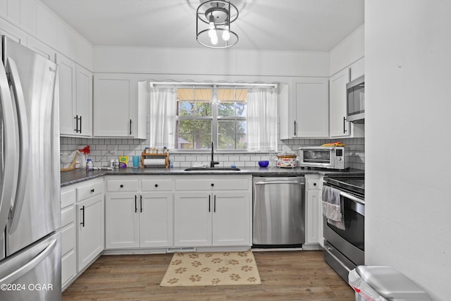 kitchen featuring sink, white cabinets, and appliances with stainless steel finishes