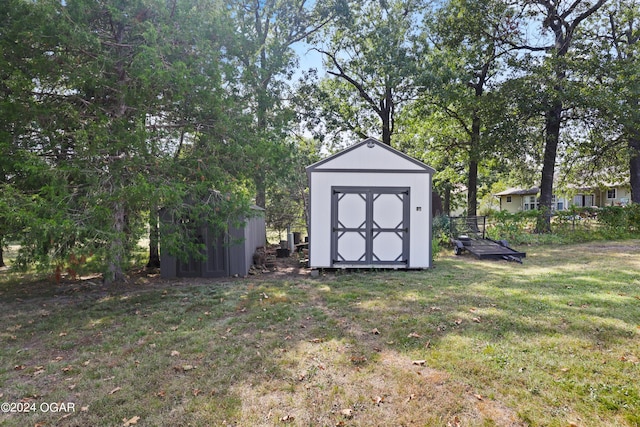 view of outdoor structure featuring a lawn