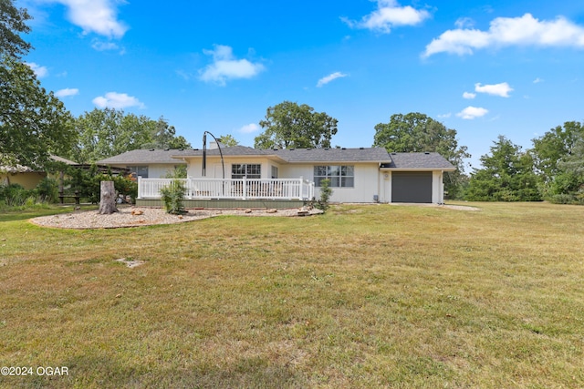 ranch-style home featuring a front yard and a garage