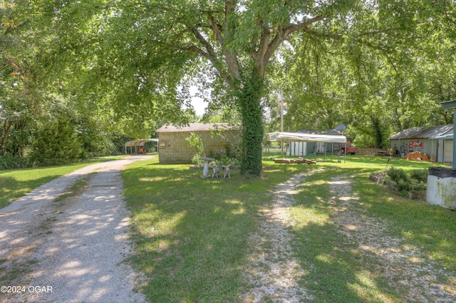 view of yard with a carport