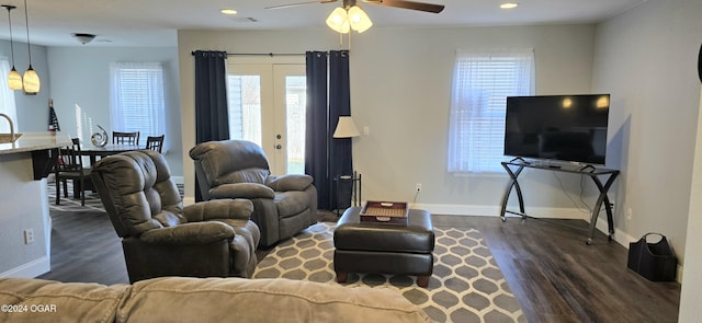 living room with ceiling fan, dark wood-type flooring, and french doors