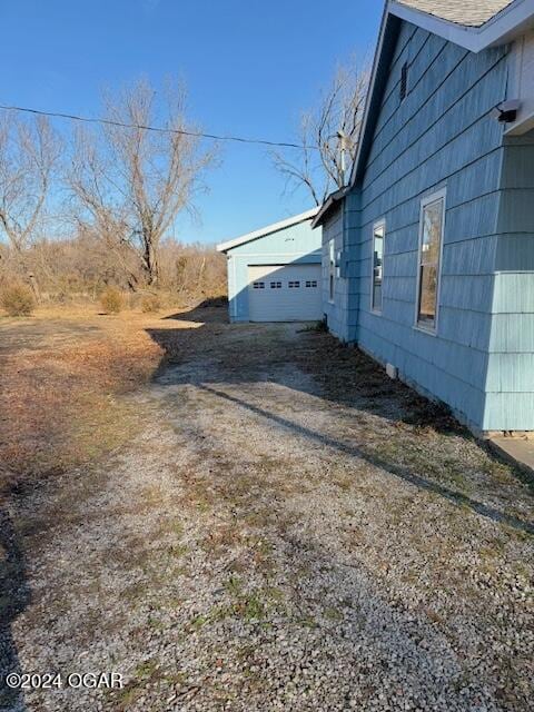 view of side of property featuring a garage