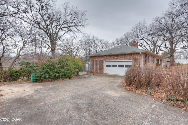 view of property exterior with a garage