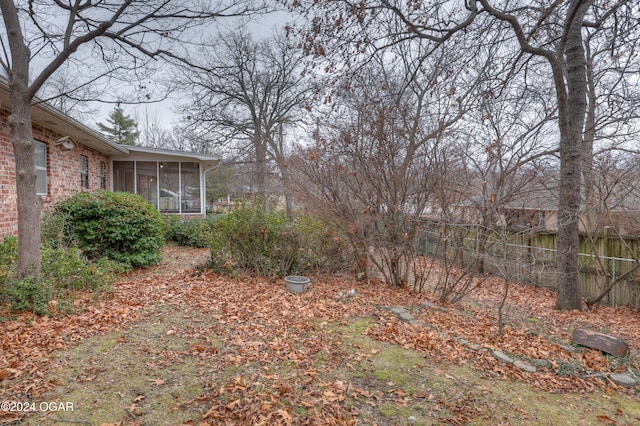 view of yard with a sunroom