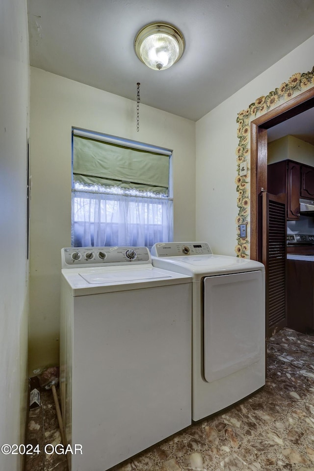 laundry area with washing machine and dryer