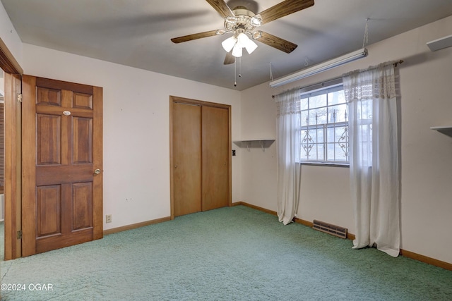 unfurnished bedroom featuring ceiling fan, light colored carpet, and a closet