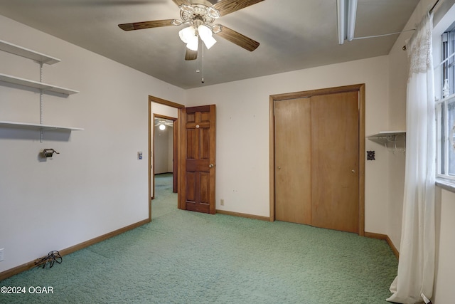 unfurnished bedroom featuring a closet, ceiling fan, and light colored carpet