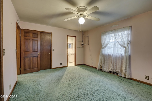 empty room with light colored carpet and ceiling fan